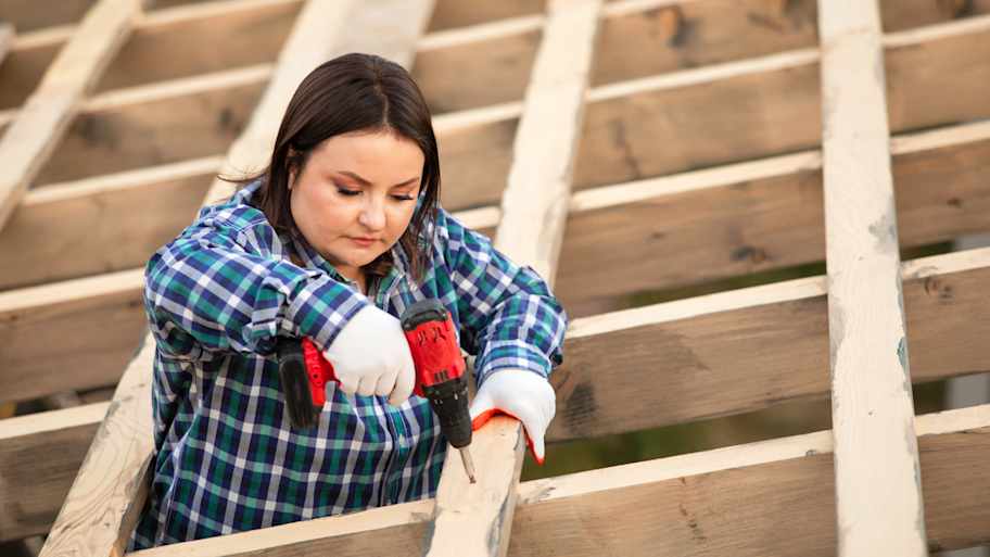 Carpenter framing the roof of a structure 